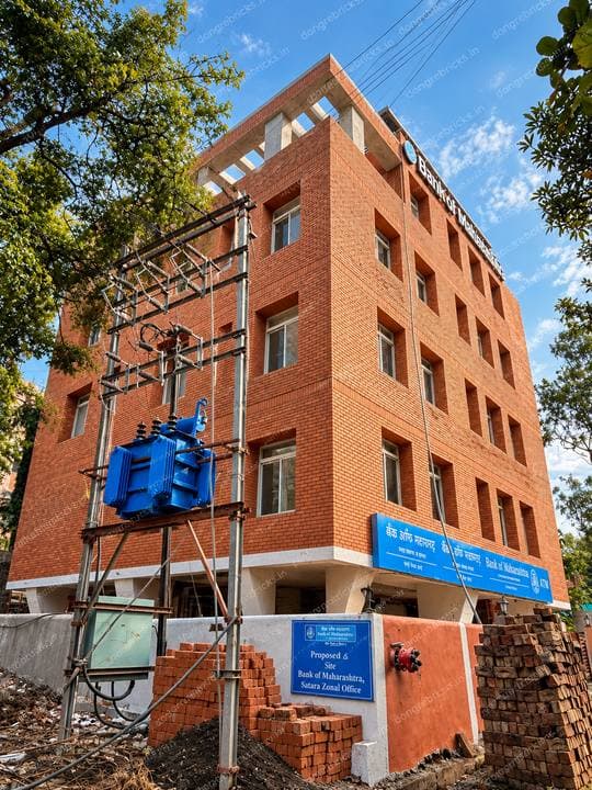 Bank of Maharashtra Satara Zonal Office under construction; site board legible, solid brick stacks on site